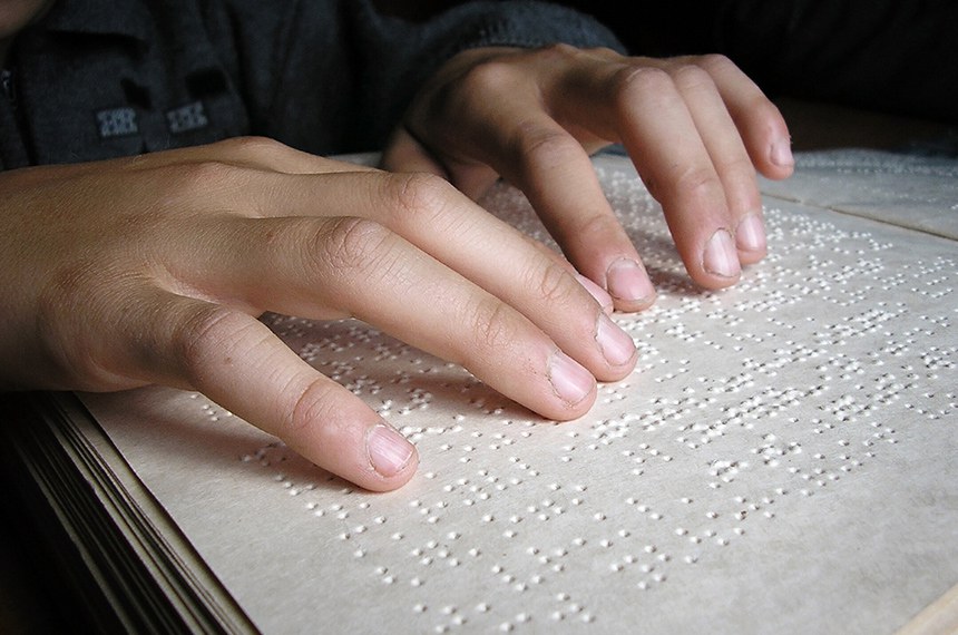 Fingers And Braille. Blind Boy Read A Book In Braille.