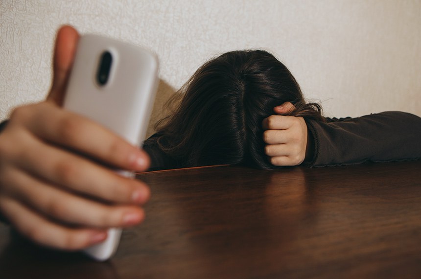 Teen Girl Excessively Sitting At The Phone At Home. He Is A Victim Of Online Bullying Stalker Social Networks - ImageCyberbullying