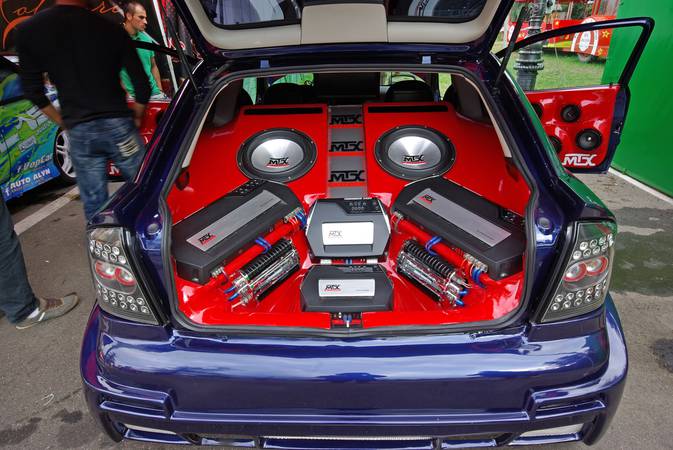 "Piatra Neamt, Romania - August 11, 2012: Opel Astra with extreme sound tuning, by MTX Audio at Piatra Neamt Tunin Fest, 2nd edition. Visitors wants to see the interior of this car"