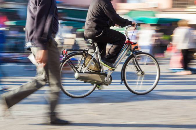 cyclist and pedestrian in motion blur
