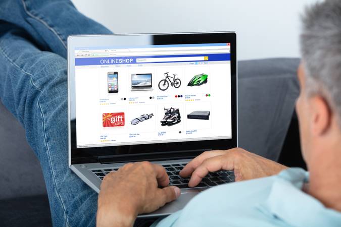 Man Shopping Online On Laptop