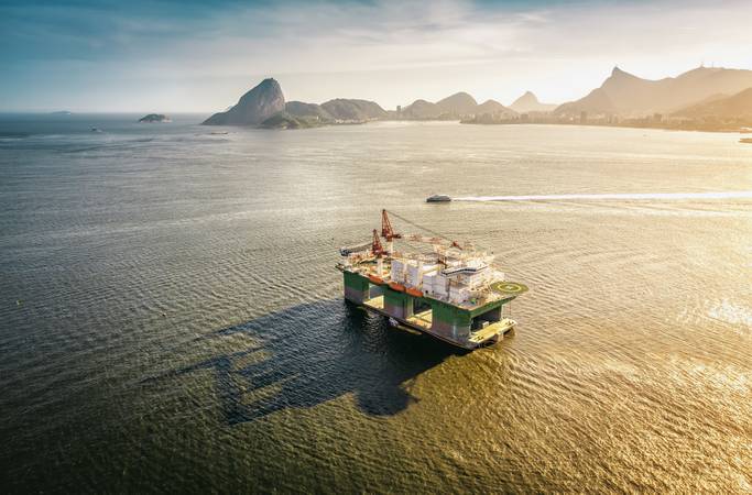 Oil drilling rig against panorama of Rio De Janeiro, Brazil