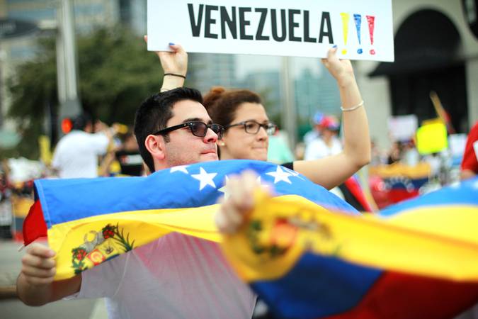 Houston, Texas, USA - February 23, 2014: Venezuelan citizens in Houston protest against the Venezuelan government and its perceived anti-Democratic policies.