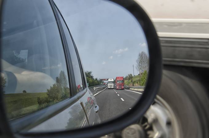 Mirror view of heavy traffic on the highway